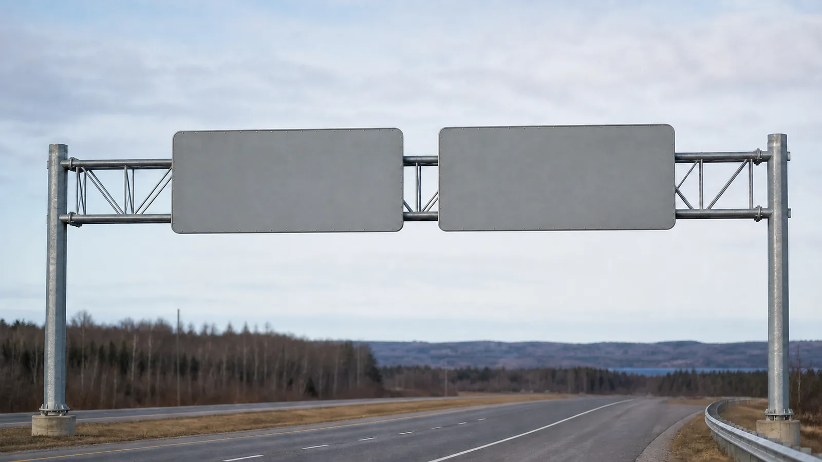 A roadside gantry carrying two blank plates against a wide pale sky, both plates deliberately empty with nothing printed on them.